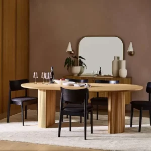 Elegant Teak Wood Allusca 6 Person Dining Table (Optional Rattan) for a modern meal, featuring a sleek wooden table with matching pleated design, contemporary black chairs, and minimalist decor under warm, ambient lighting.